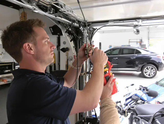 Tustin Garage Door Repair safety certified technician performing cable replacement in Tustin