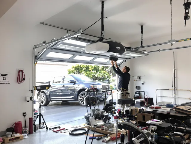 Tustin Garage Door Repair specialist installing smart garage door opener system in Tustin home